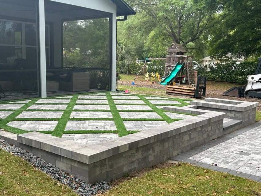 Patio with steps and retaining wall built by New Horizon Outdoor Services
